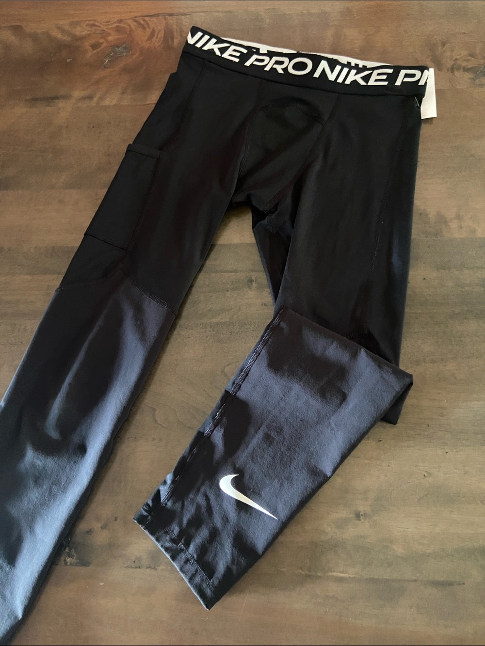 Nike Black Kids Performance Leggings with White Swoosh